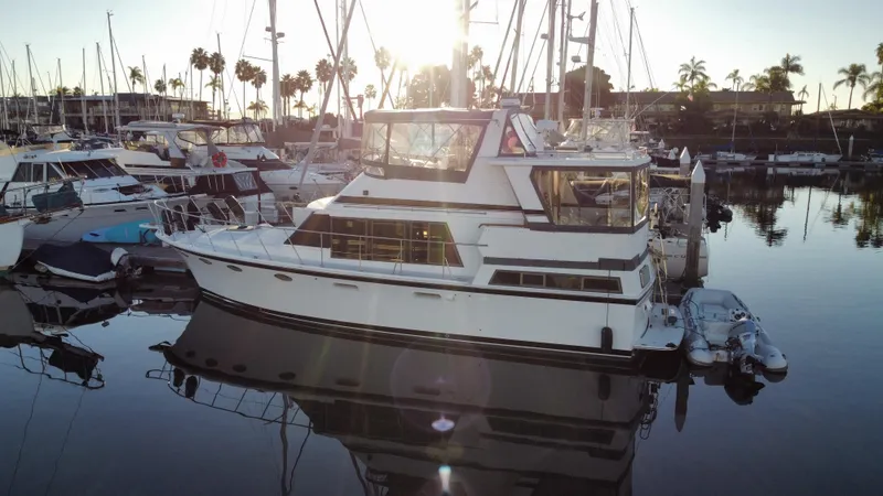 Slide: The Image of 1991 Lien Hwa McKinna 42 Aft Cabin yacht docked in marina at sunset. - 13