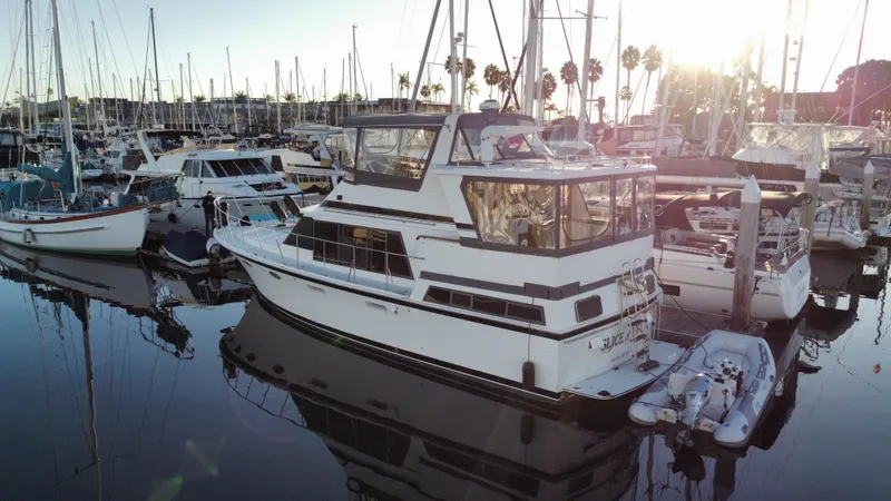 Slide: The Image of 1991 Lien Hwa McKinna 42 Aft Cabin yacht docked in a marina at sunset. - 14