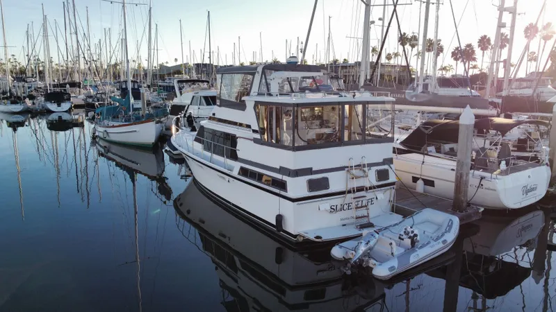 Slide: The Image of 1991 Lien Hwa McKinna 42 Aft Cabin yacht docked in a marina. - 16