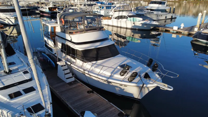 Slide: The Image of 1991 Lien Hwa McKinna 42 Aft Cabin yacht docked at marina, surrounded by boats. - 23
