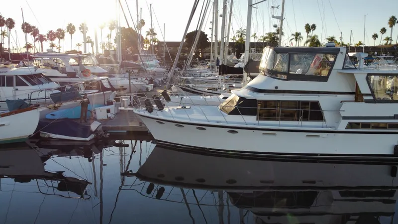 Slide: The Image of 1991 Lien Hwa McKinna 42 Aft Cabin yacht docked in a marina at sunset. - 24