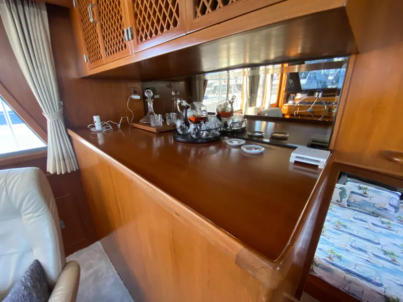 Slide: The Image of 1991 Lien Hwa McKinna 42 Aft Cabin interior with wooden cabinetry and bar setup. - 31