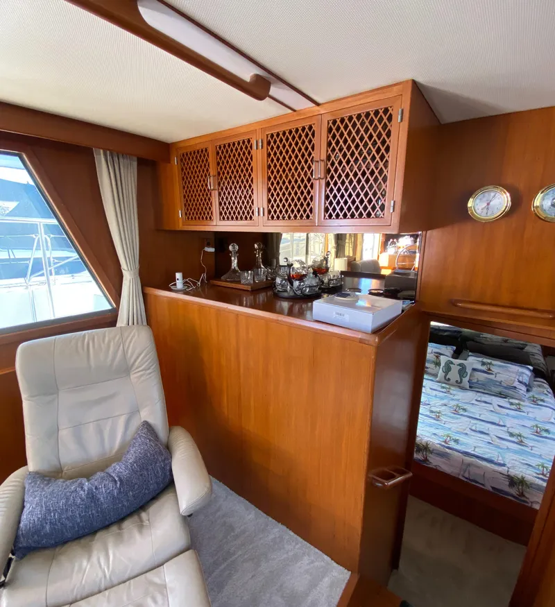 Slide: The Image of 1991 Lien Hwa McKinna 42 Aft Cabin interior with wood paneling and comfortable seating. - 32