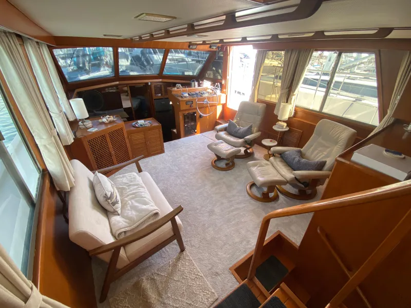 Slide: The Image of Interior of 1991 Lien Hwa McKinna 42 Aft Cabin yacht, featuring cozy seating and wooden accents. - 33