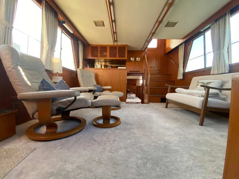 Slide: The Image of Luxurious interior of 1991 Lien Hwa McKinna 42 Aft Cabin yacht with plush seating and wood accents. - 34