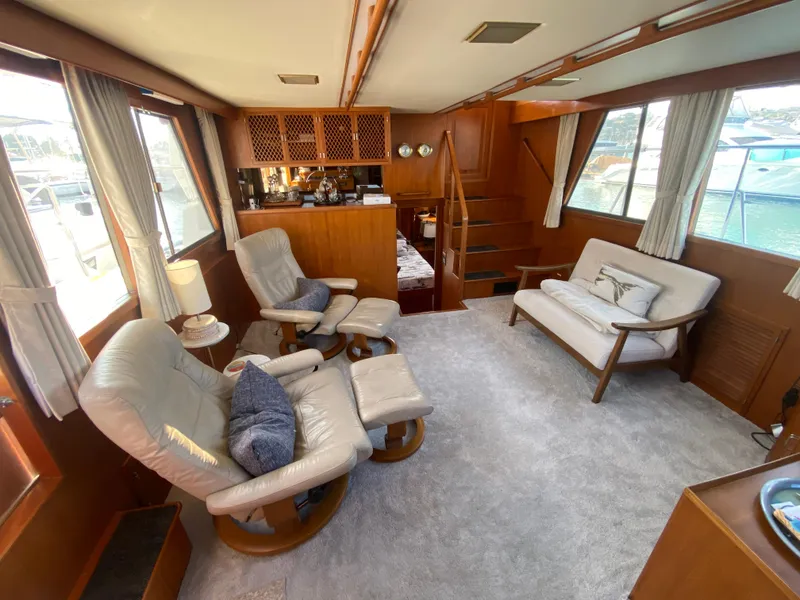 Slide: The Image of 1991 Lien Hwa McKinna 42 Aft Cabin interior with cozy seating and wooden accents. - 35