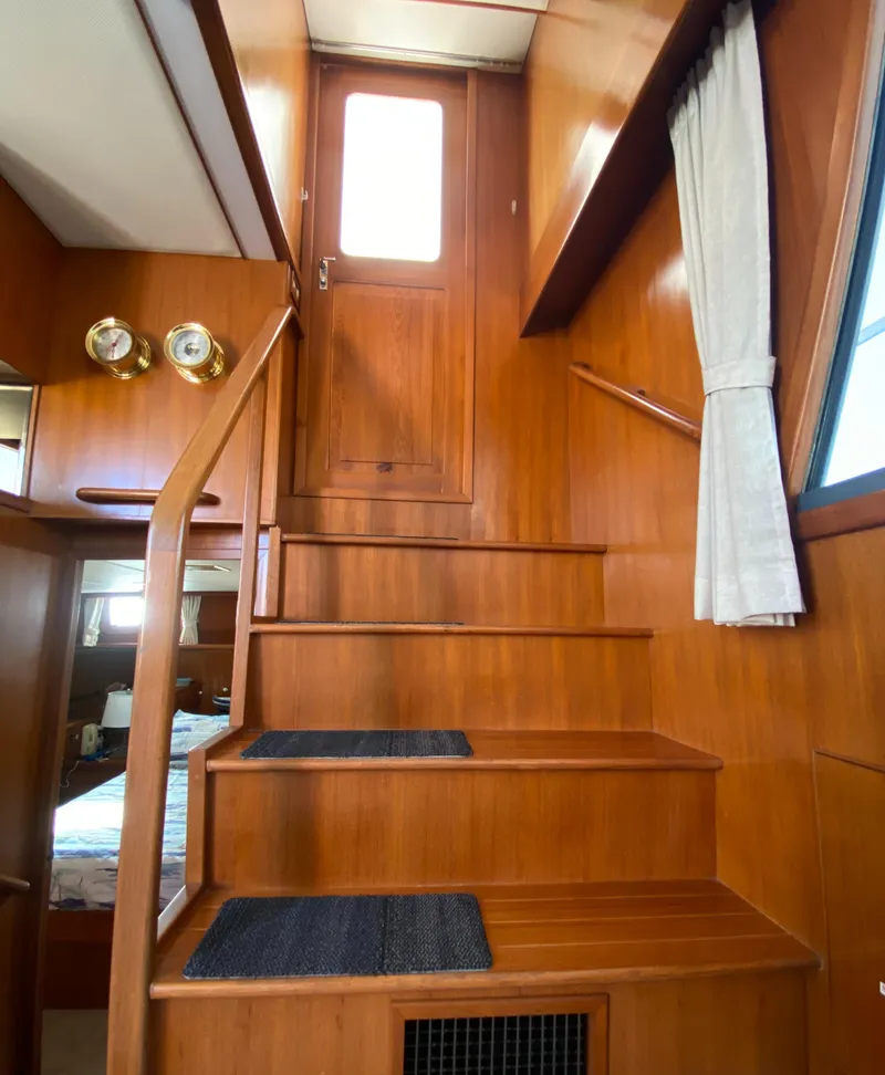Slide: The Image of Interior of 1991 Lien Hwa McKinna 42 Aft Cabin with wooden stairs and nautical decor. - 38