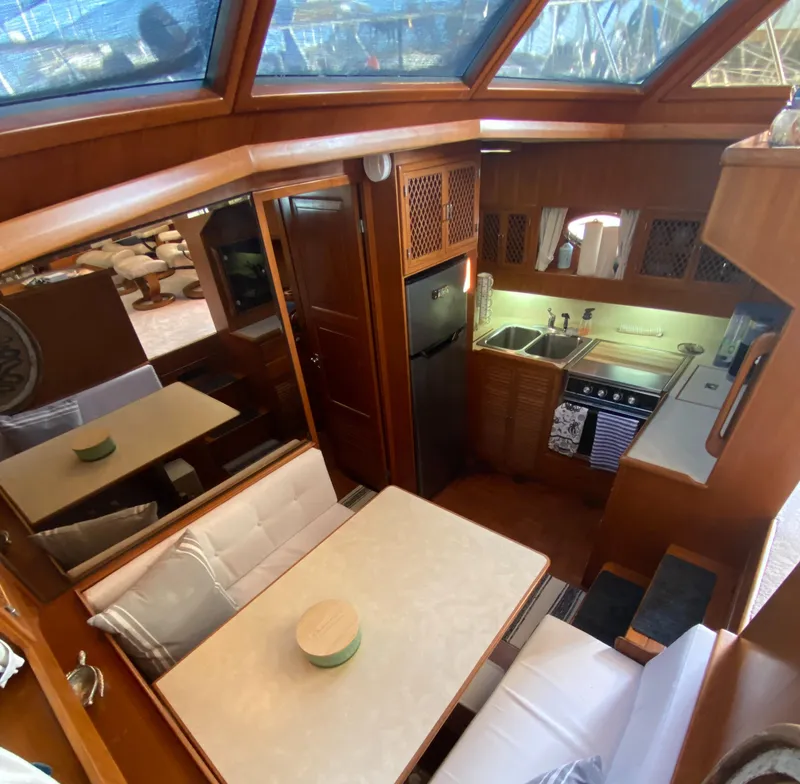 Slide: The Image of Interior of 1991 Lien Hwa McKinna 42 Aft Cabin yacht, featuring kitchen and dining area. - 43