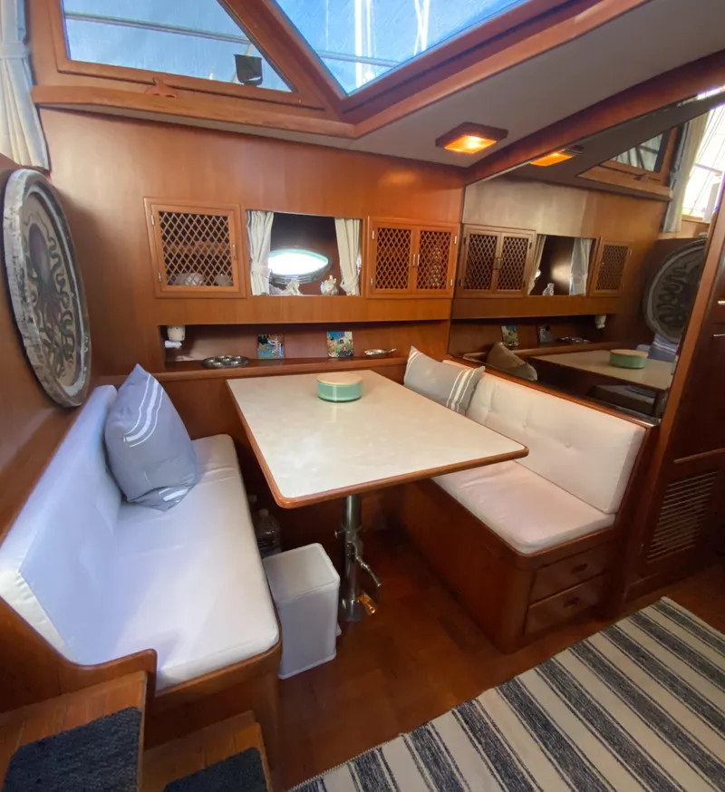 Slide: The Image of Cozy dining area in 1991 Lien Hwa McKinna 42 Aft Cabin yacht with wood accents. - 45