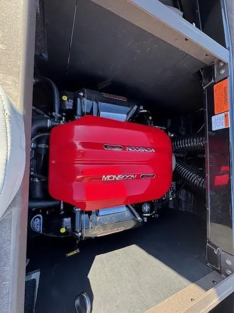 Slide: The Image of 2019 Axis A24 boat engine with red Monsoon cover. - 20