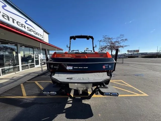 Slide: The Image of 2019 Axis A24 boat parked outside a water sports store on a sunny day. - 4