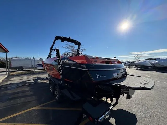Slide: The Image of 2019 Axis A24 boat in parking lot under clear blue sky. - 5