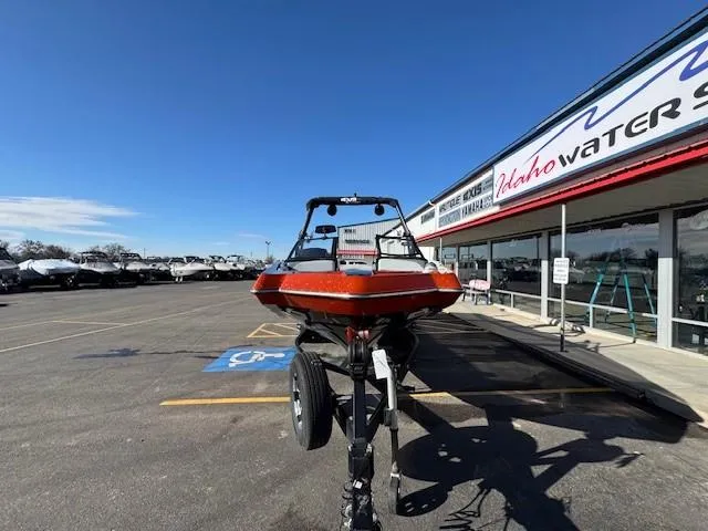 Slide: The Image of 2019 Axis A24 boat on trailer at dealership parking lot. - 8