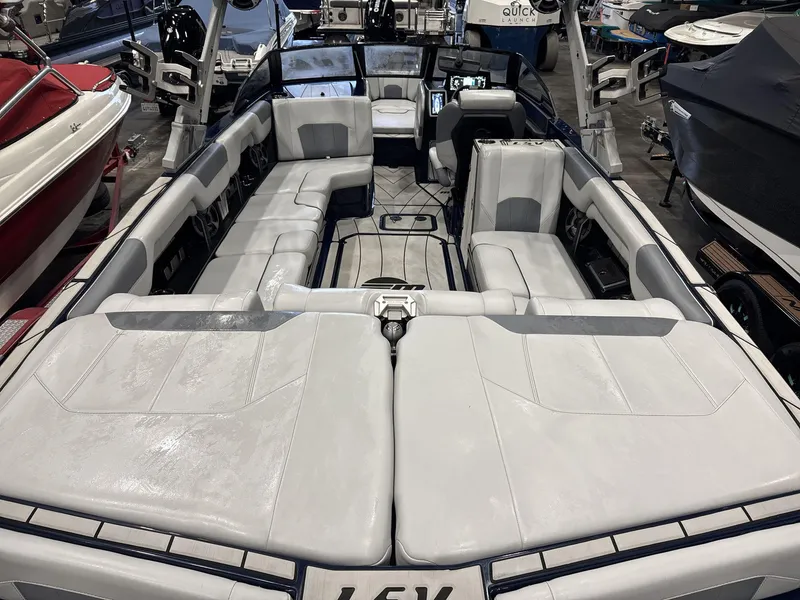 Slide: The Image of 2021 Malibu 25 LSV boat interior with spacious seating and modern design. - 6