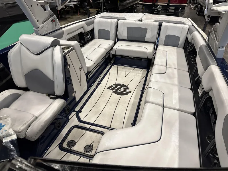 Slide: The Image of Interior of a 2021 Malibu 25 LSV boat with spacious seating and modern design. - 8