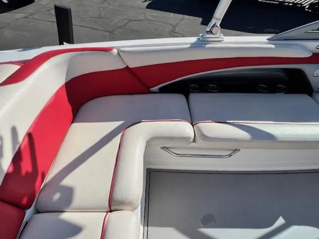 Slide: The Image of 2006 MasterCraft X45 boat interior with red and white seating. - 13
