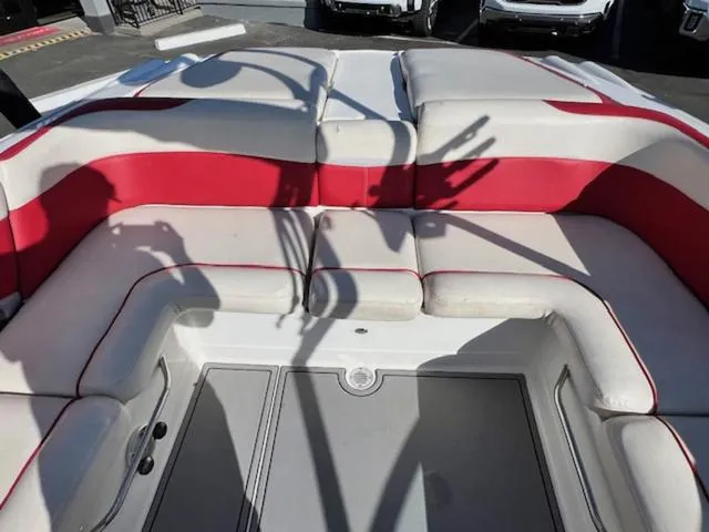 Slide: The Image of 2006 MasterCraft X45 boat interior with red and white seating. - 14