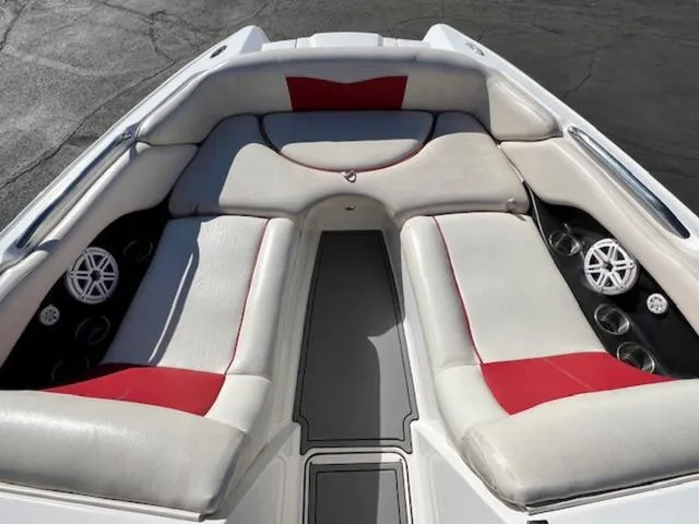 Slide: The Image of 2006 MasterCraft X45 boat interior with white and red cushioned seating. - 16