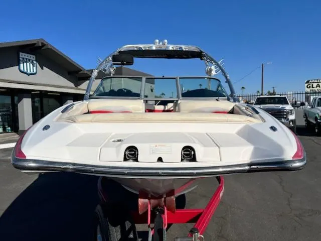 Slide: The Image of 2006 MasterCraft X45 boat on trailer, viewed from the rear, under clear blue sky. - 3