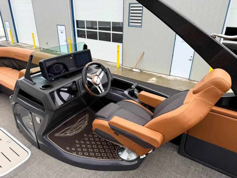 Slide: The Image of 2025 Bennington 24MSB boat interior with modern helm and luxurious seating. - 11