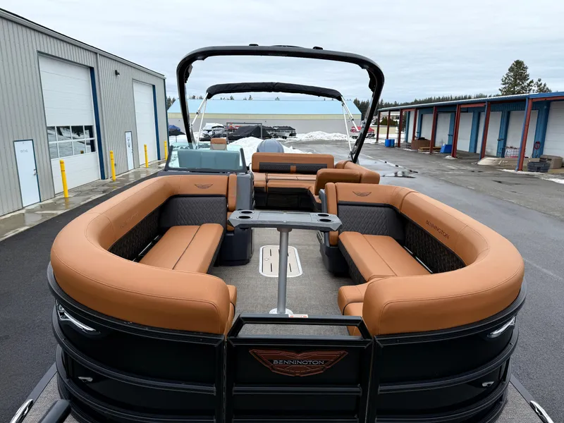 Slide: The Image of 2025 Bennington 24MSB pontoon boat with luxurious seating and sleek design. - 13