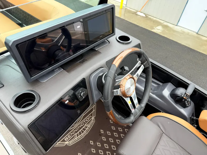 Slide: The Image of Interior of 2025 Bennington 24MSB boat with modern dashboard and steering wheel. - 15