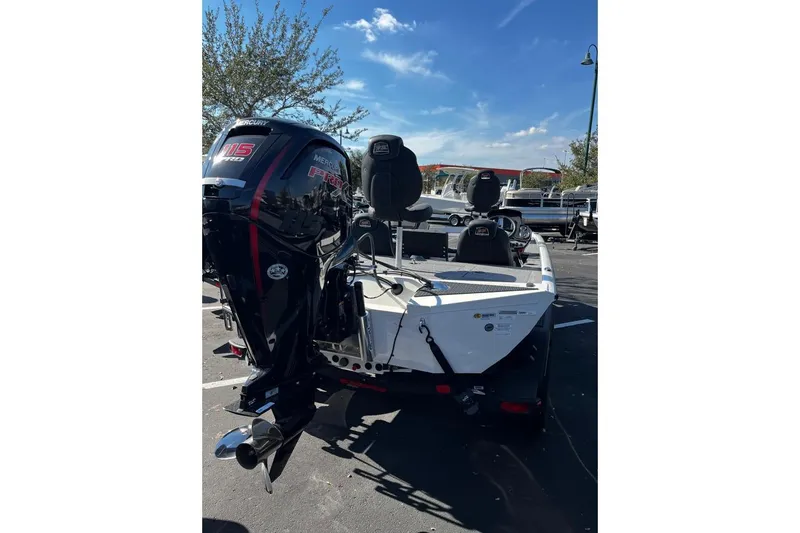Slide: The Image of 2025 Ranger RT188P boat with Mercury 115 Pro XS engine in parking lot. - 2