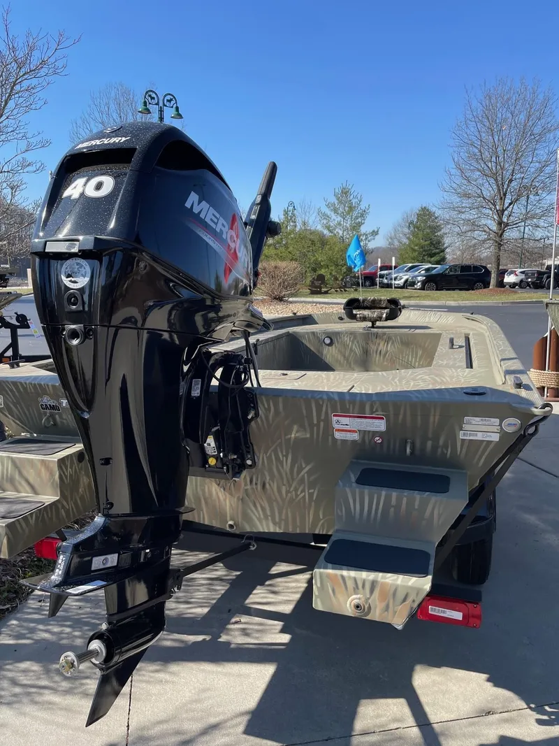 Slide: The Image of 2025 Tracker Grizzly 1654 T Sportsman boat with Mercury 40 outboard motor. - 40