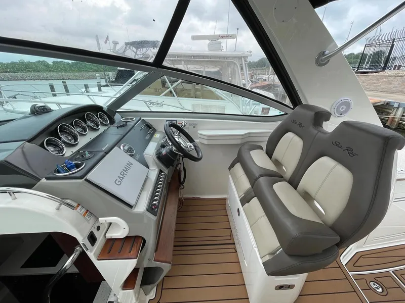 Slide: The Image of 2015 Sea Ray 350 Sundancer helm with Garmin navigation and dual seating. - 3