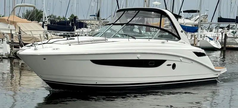 Slide: The Image of 2015 Sea Ray 350 Sundancer yacht docked in a marina. - 4