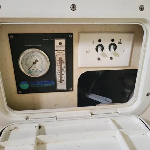 Slide: The Image of Control panel of a 2001 Voyage Maxim, featuring gauges and switches. - 10