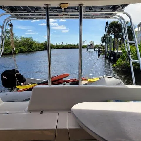 Slide: The Image of Boat deck view of a serene river with lush greenery, Voyage Maxim 2001. - 11