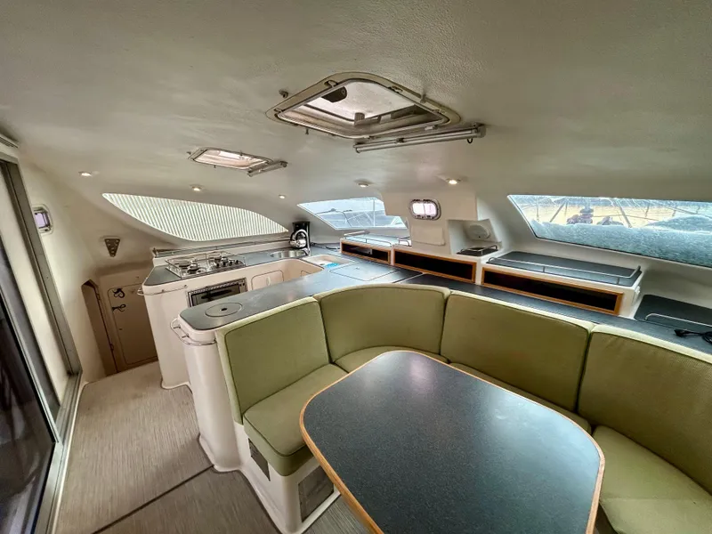 Slide: The Image of Interior of 2001 Voyage Maxim yacht with modern kitchen and seating area. - 32