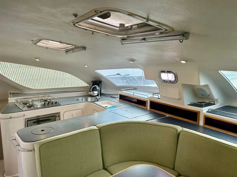 Slide: The Image of Interior of 2001 Voyage Maxim yacht with modern kitchen and seating area. - 33