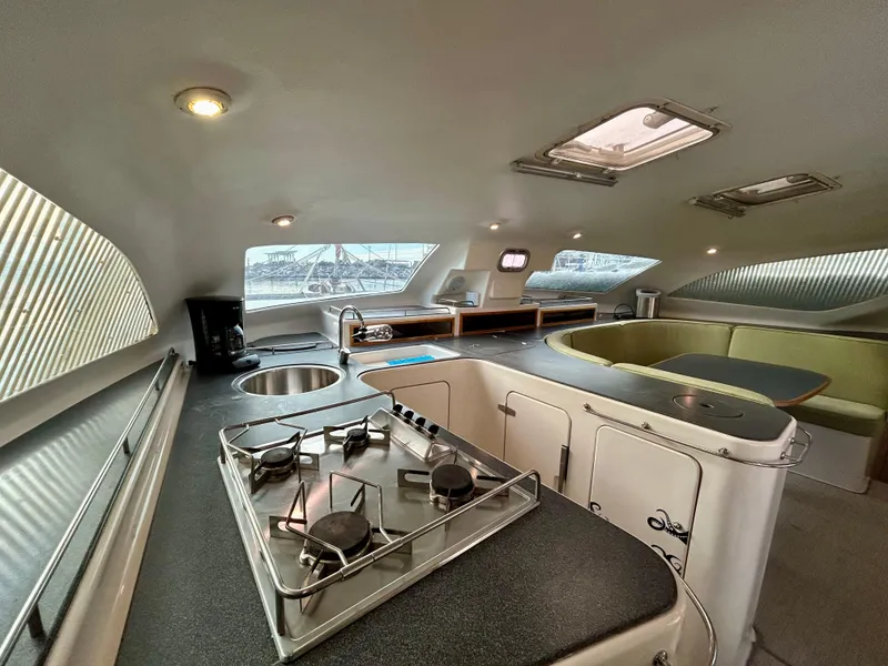 Slide: The Image of Interior of 2001 Voyage Maxim yacht with modern kitchen and seating area. - 36