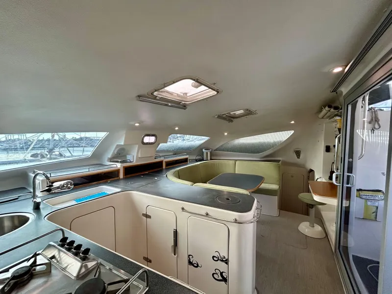 Slide: The Image of Spacious interior of 2001 Voyage Maxim yacht with modern kitchen and seating area. - 37