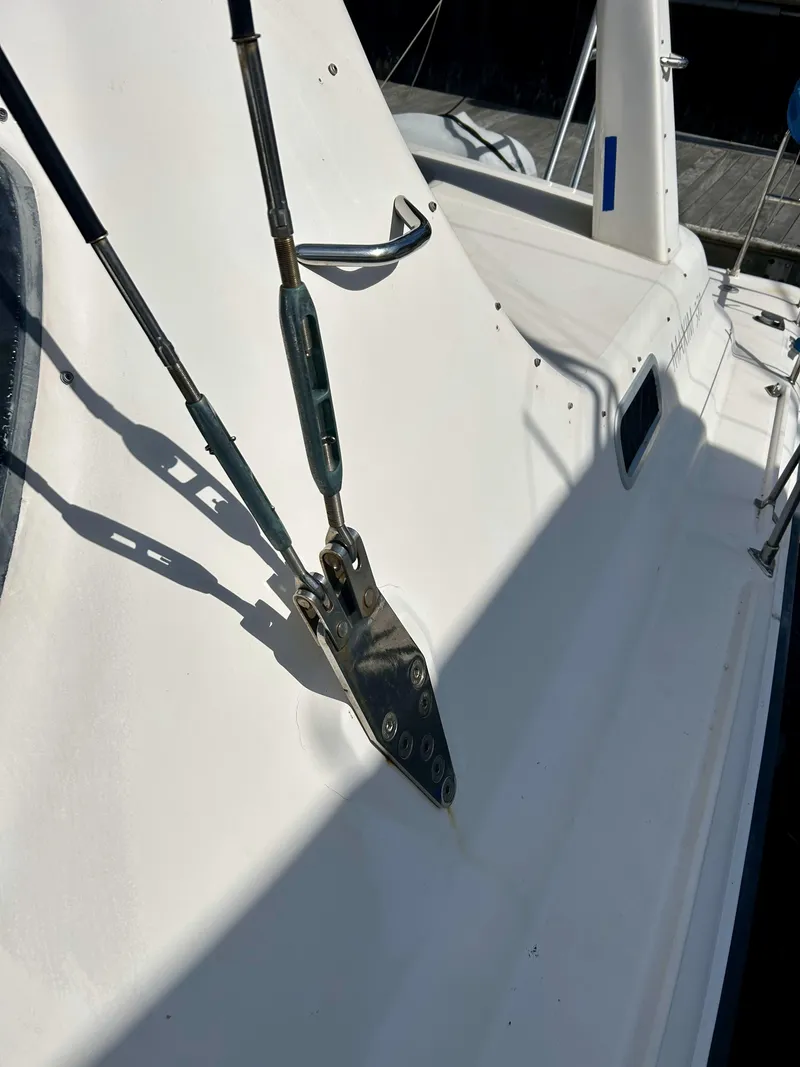 Slide: The Image of Close-up of a 2001 Voyage Maxim sailboat deck with rigging details. - 43