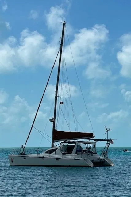 Slide: The Image of Sailboat Voyage Maxim 2001 on calm sea under blue sky with clouds. - 6