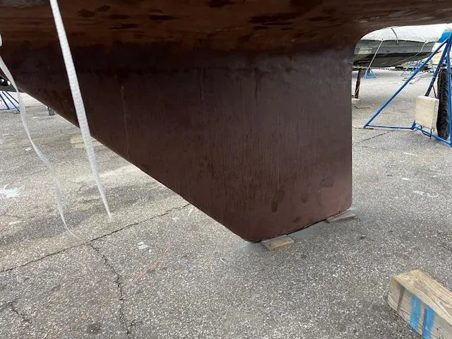 Slide: The Image of Keel of a 1983 Sabre 38 sailboat on a dry dock. - 14