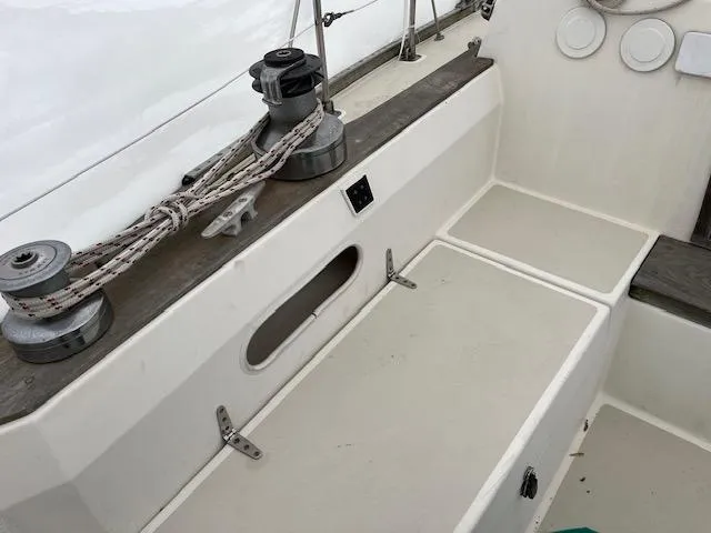Slide: The Image of 1983 Sabre 38 sailboat cockpit with winches and ropes. - 17