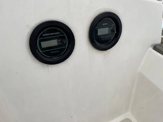 Slide: The Image of Speed and depth gauges on a 1983 Sabre 38 sailboat dashboard. - 21