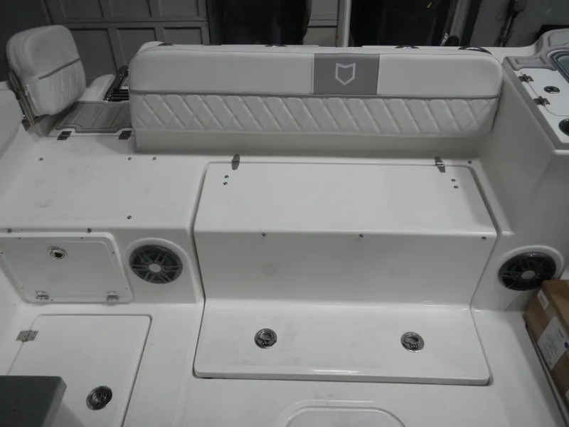 Slide: The Image of 2025 Sea Fox 268 Traveler boat interior with white seating and storage compartments. - 10