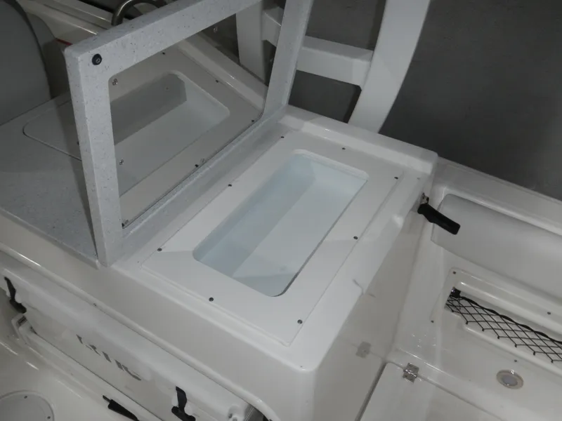Slide: The Image of 2025 Sea Fox 268 Traveler boat interior detail with storage compartment and seating area. - 17