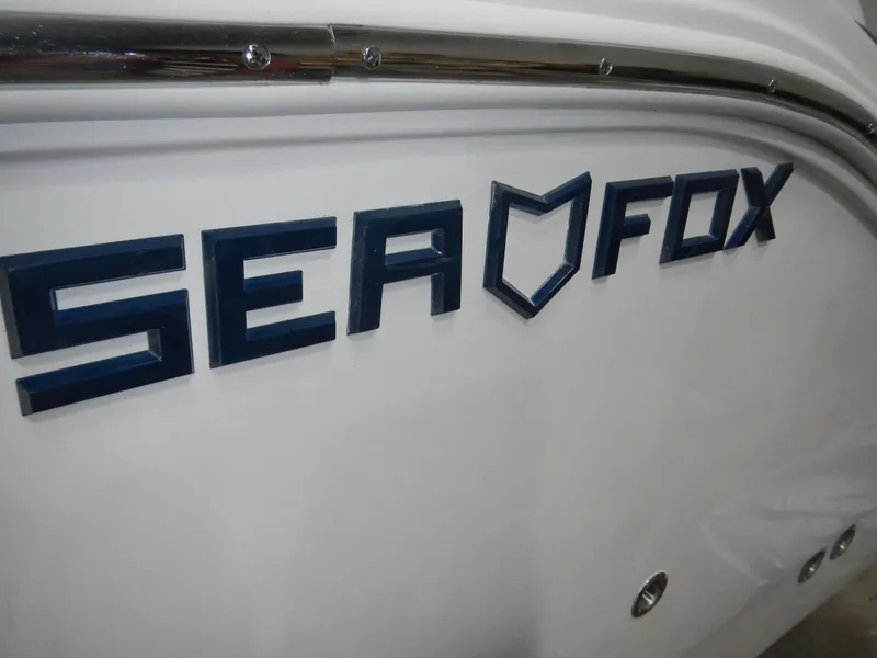 Slide: The Image of 2025 Sea Fox 268 Traveler boat logo on white hull. - 20