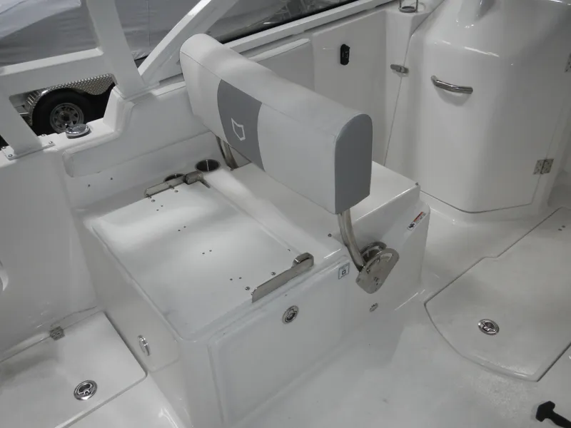 Slide: The Image of 2025 Sea Fox 268 Traveler boat interior with white seating and storage compartments. - 7