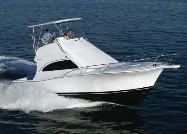 Slide: The Image of 2007 Luhrs 36 Convertible yacht cruising on open water. - 0