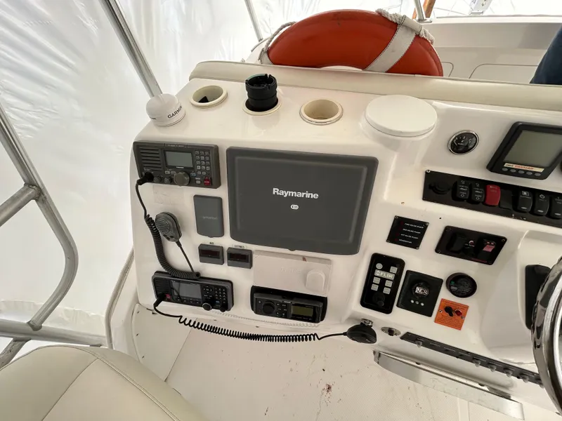 Slide: The Image of Control panel of 2007 Luhrs 36 Convertible boat with Raymarine electronics. - 1