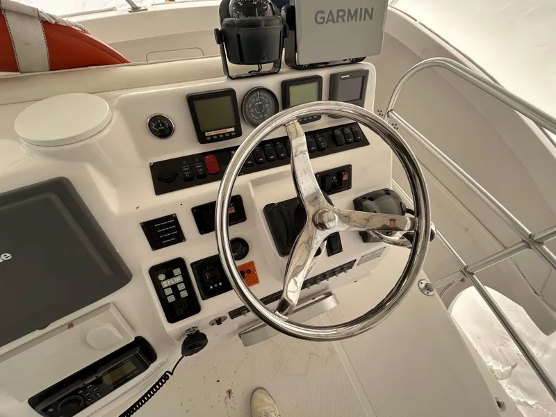 Slide: The Image of 2007 Luhrs 36 Convertible helm with Garmin navigation and control instruments. - 2