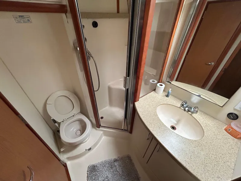 Slide: The Image of Bathroom interior of 2007 Luhrs 36 Convertible yacht with shower, sink, and toilet. - 20