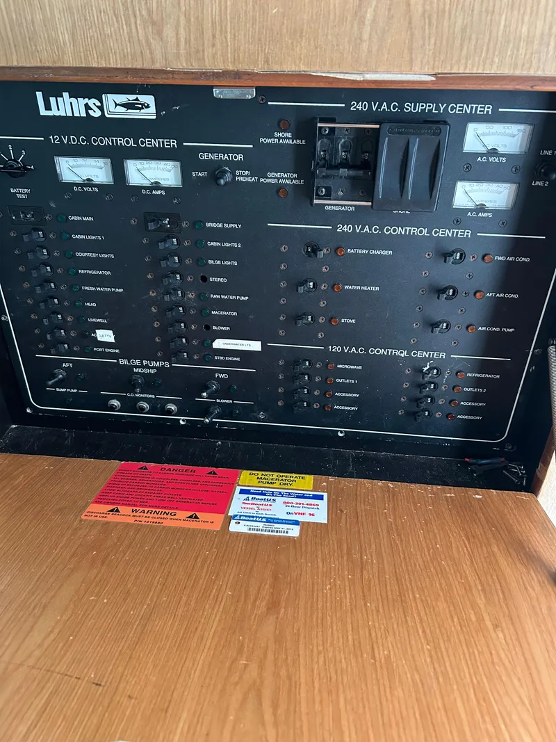 Slide: The Image of Luhrs 36 Convertible 2007 control panel with various switches and indicators. - 21